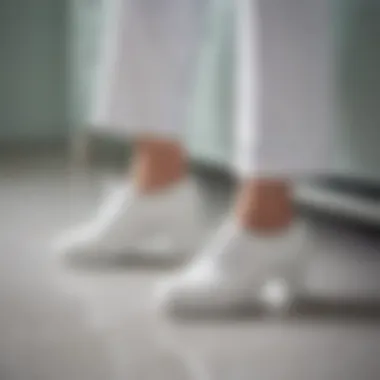 Stylish all-white nursing shoes on a hospital floor