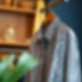 Elegant display of a black and white striped long sleeve shirt on a hanger