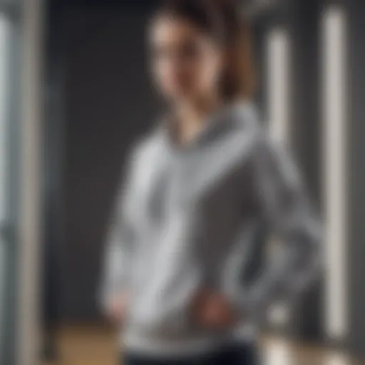 Person exercising in a stylish sweatshirt, showcasing comfort and flexibility.