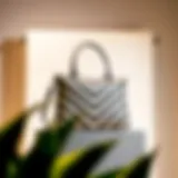 Elegant chevron shoulder bag displayed on a minimalist backdrop