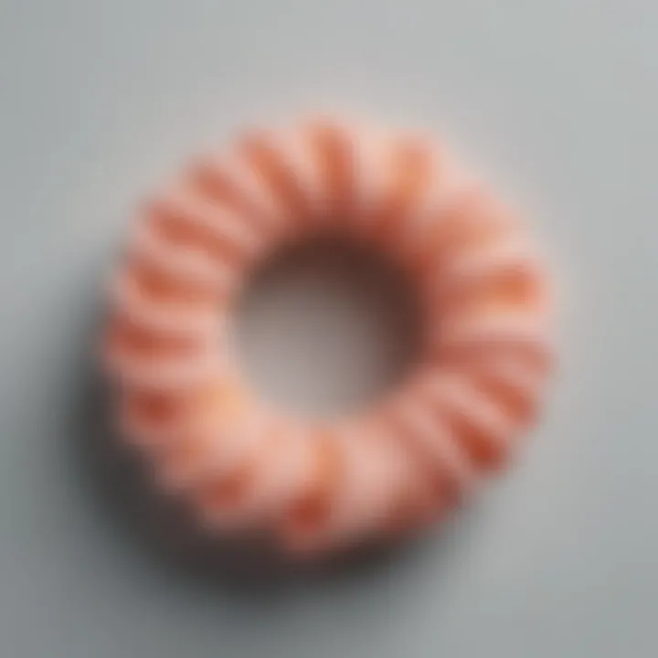 An elegant collection of spiral hair ties glowing in the dark on a minimalist background.