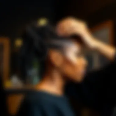 A stylist expertly installing pre looped butterfly locs