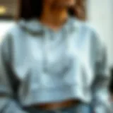 Cropped Sweatshirt with Innovative Drawstring Design Cropped sweatshirt showcasing drawstring detail