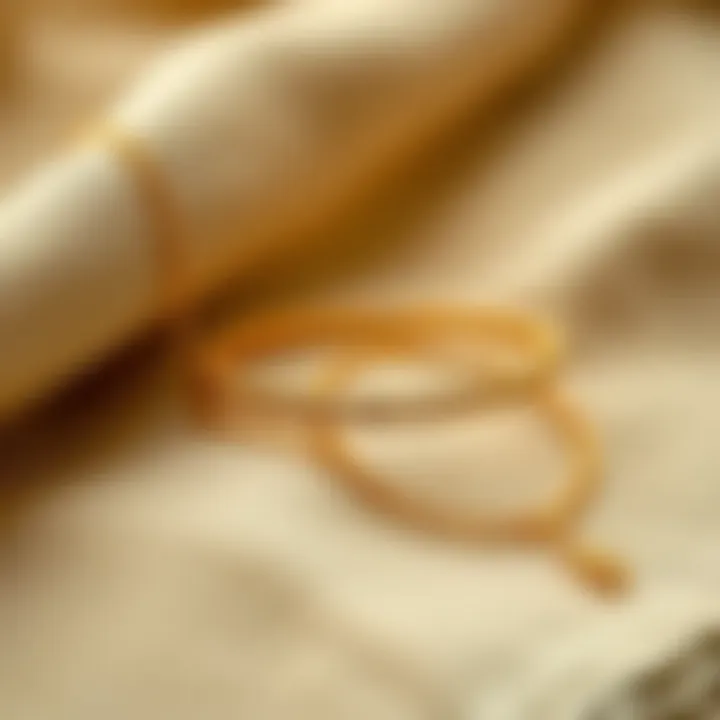 Elegant Gold Anklet Extender Display A stylish gold anklet extender elegantly displayed on a fabric surface.