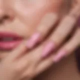 Close-up view of pink glue application on nails