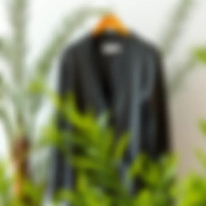 An eco-friendly cardigan made from sustainable materials displayed next to a plant.