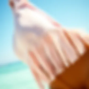 Close-up of fabric textures and fringe embellishments on a swimsuit