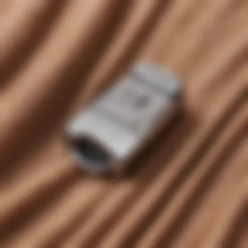 Close-up of a fabric shaver on a cashmere garment showing its effectiveness