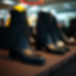 Elegant black fringe boots displayed on a textured surface